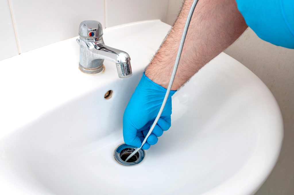 Plumber in St Thomas fixing drain