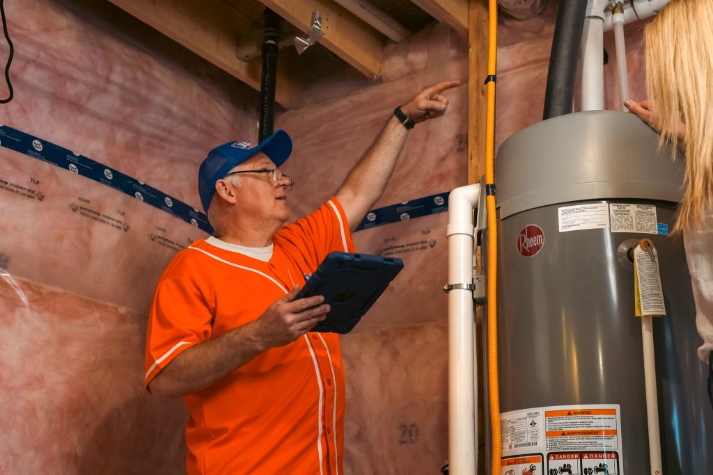 Plumber in St Thomas fixing pipe